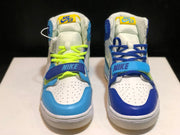 Front-facing view of both sneakers showing mismatched blue toe overlays, white perforated panels, and contrasting laces.