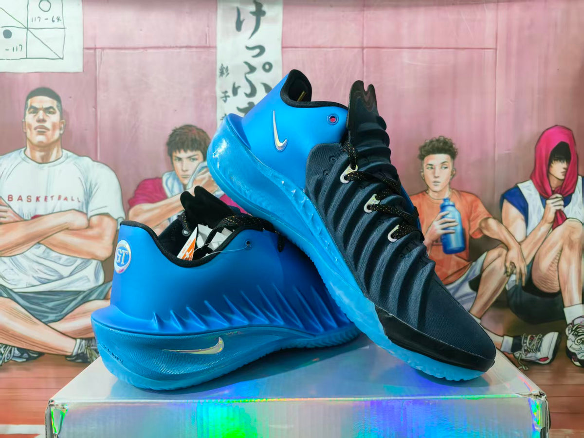 Pair of black and blue high-top basketball sneakers displayed on a reflective box, with a visible Nike Swoosh.