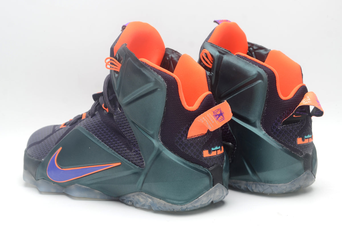 Pair of black and dark green high-top basketball sneakers with purple and orange accents, shown from the side and rear.