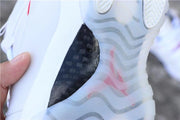 Close-up of the translucent outsole and black carbon-fiber-style midfoot detail.