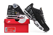 Black and white Nike Air Max Plus III sneakers displayed with a shoe box