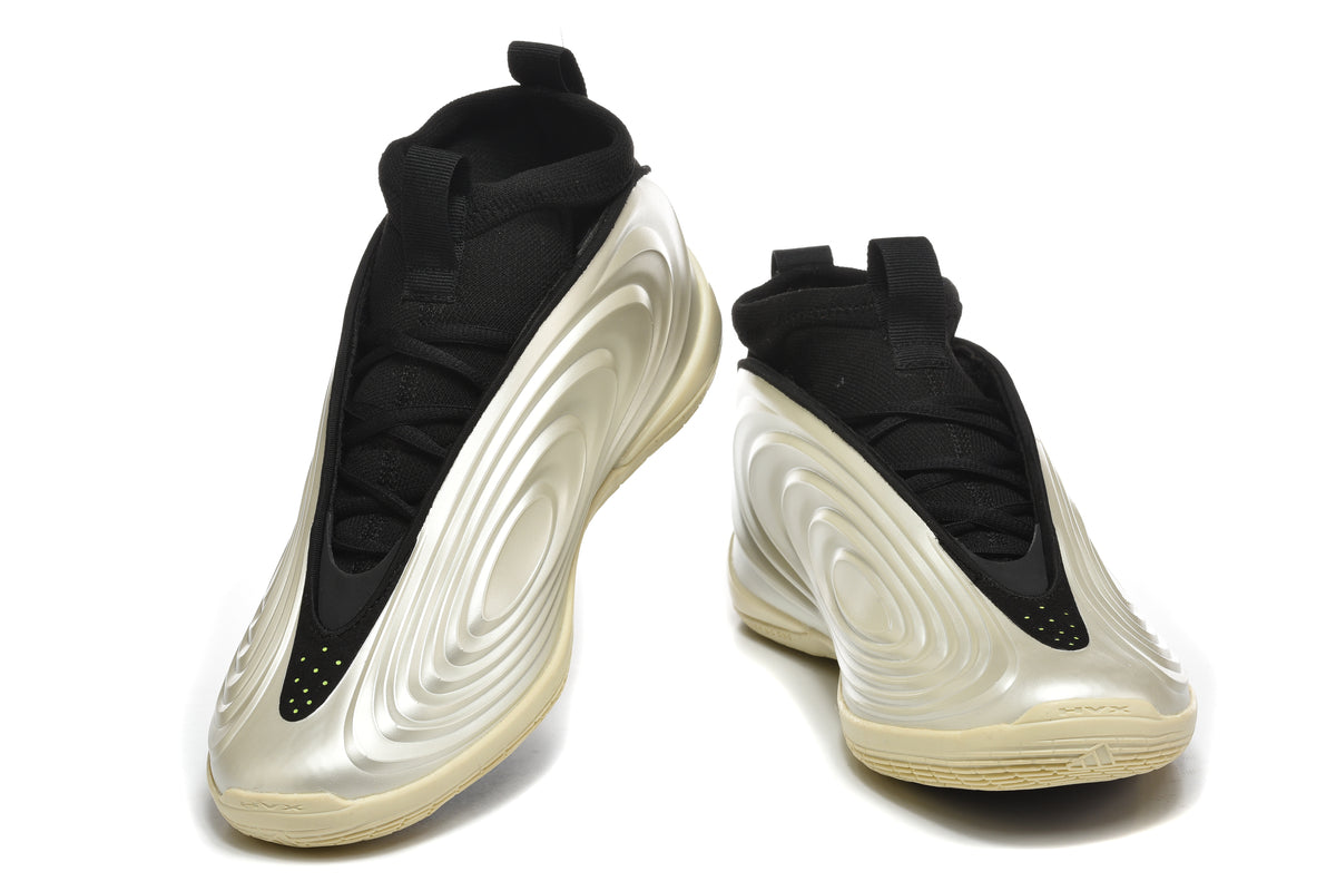 Pair of black and silver high-top basketball shoes with bright green accents, shown from the front