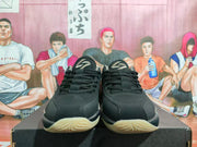 Front view showing the black uppers, laces, padded tongues, and cream-colored outsoles.