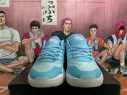 Front view of ice blue Nike basketball sneakers with tonal laces, textured toe panels, and white midsoles.
