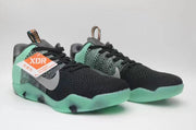 Pair of black and mint Nike Kobe 11 All-Star shoes from the front