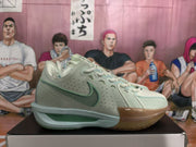 Side view of a green Nike basketball sneaker showing the perforated upper, contrasting Swoosh, layered midsole, and visible ZoomX marking.