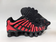 Black and pink sneaker shown beside its textured outsole.