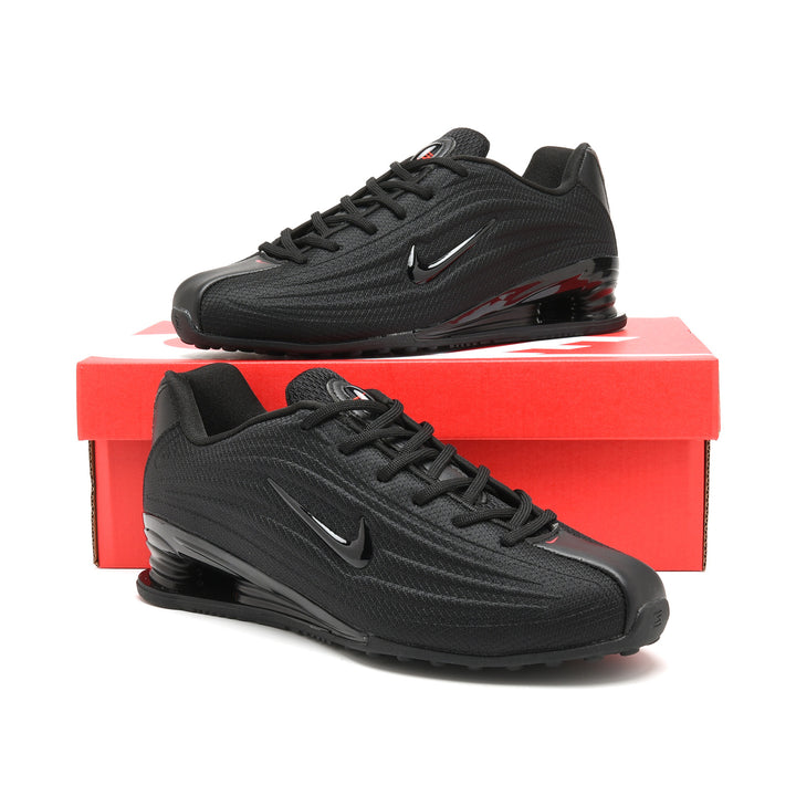 Black Nike Shox Z R2 sneakers displayed on a red shoe box