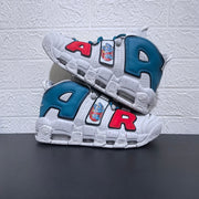 Pair of white sneakers with oversized colored lettering and bear graphics
