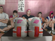 Rear view of white Nike GT sneakers with pink and orange heel details, displayed on a shoebox.