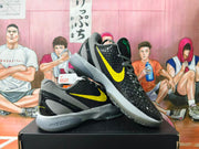 Pair of black and yellow Nike Kobe 6 shoes shown at an angle.