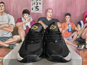 Front view of the pair showing black laces, Jumpman tongue logos, and white and gold toe accents.