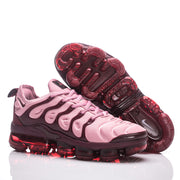 Nike TN-18 sneakers shown from the side and underside.