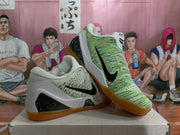 Angled display of the Nike Kobe basketball shoes showing the black Swooshes, patterned uppers, speckled side panels, and gum outsoles.