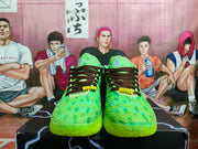 Front view of bright green Nike sneakers with dark brown laces, yellow detailing, and textured uppers.