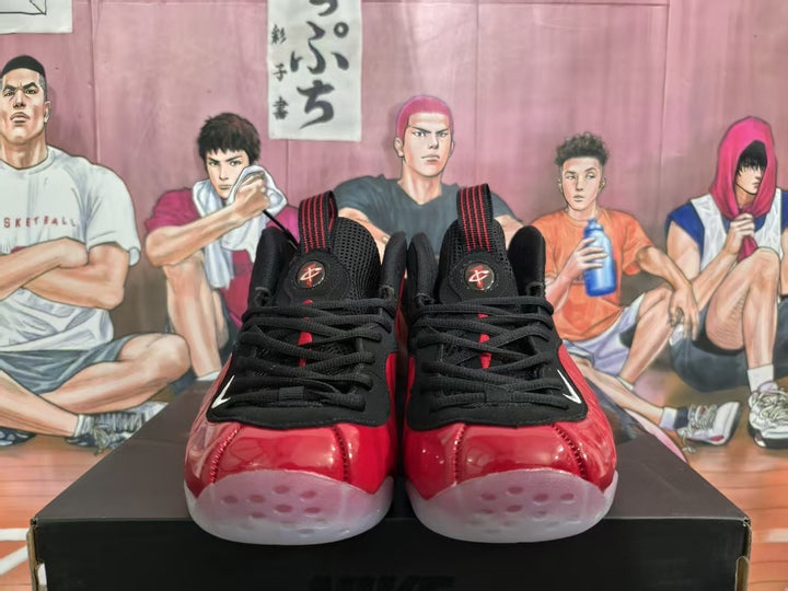 Front view of red and black high-top sneakers with black laces, translucent toe sections, and Nike branding.