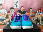 Front view of the teal Nike Kobe basketball shoes with purple laces.