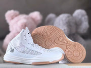 Side and outsole views showing patterned gum-colored tread