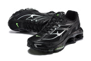 Pair of black Nike Shox Ride 2 sneakers with silver-toned side details and small green accents.