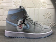 Side profile of the gray and pale blue high-top sneaker with attached decorative tags visible.