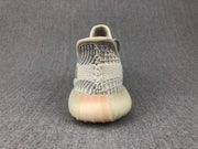Rear view showing the knitted heel construction, padded collar, and translucent sole.