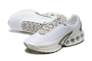 Pair of white and grey Nike Air Max DN sneakers shown from an angled side view.