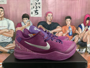 Side view of purple Nike Kobe basketball shoe with silver swoosh