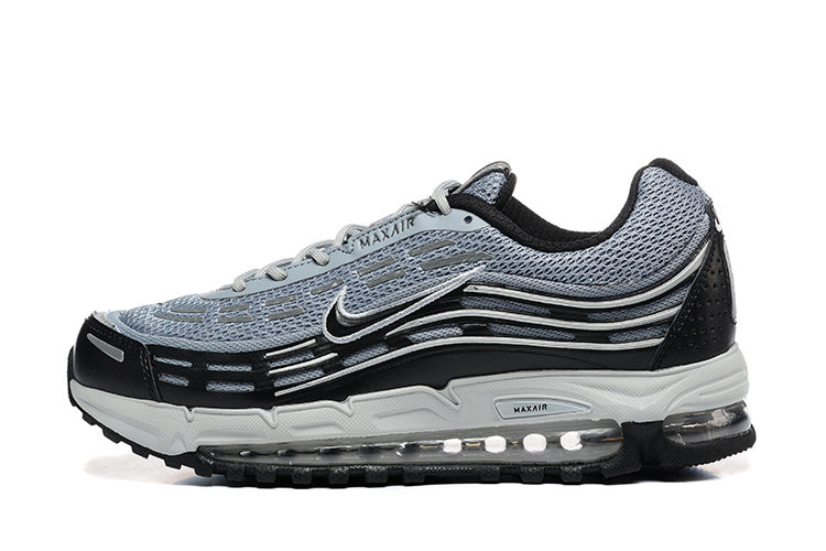 Side view of grey and black Nike Air Max 97 OG sneakers