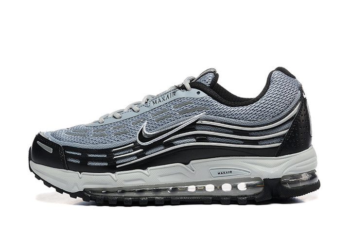 Side view of grey and black Nike Air Max 97 OG sneakers