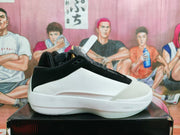 Side view of a black and white Jordan Luka 1 basketball shoe.