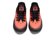 Top view of a coral and purple Nike S.T. Flare EP sneaker pair.