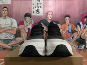 Front view of black and white On sneakers with lace-up closures and sculpted soles