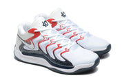 Three-quarter view of the white sneakers with red lace accents, black detailing, and KD logos.