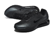 Pair of black Nike Air Max sneakers shown at an angled view.
