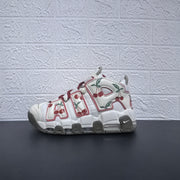 Side profile of a white cherry-print Nike Air More Uptempo sneaker