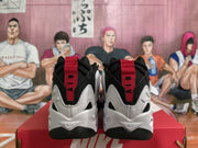 Rear view of the sneakers showing red heel tabs and white-and-black detailing.