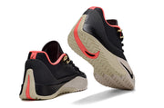 Rear and outsole view of black Nike S.T. Flare EP sneakers with red and beige details.
