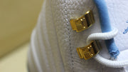 Close-up of the gold-tone lace hardware.