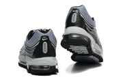 Rear views of grey and black Nike Air Max 97 OG sneakers