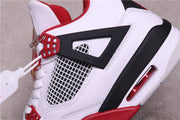 Close-up of the black side wing, white mesh panel, red lace hardware, and visible heel Air unit.