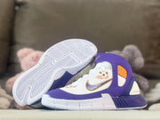 Side view with one shoe tilted to display the patterned rubber outsole.