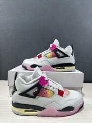 Angled side view highlighting the white upper, pink and black midsole sections, and colorful perforated panels.