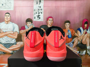 Heel view of coral pink Jordan shoes with Jordan branding