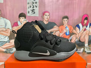 Side profile of a black Nike basketball sneaker showing layered upper panels, a contrasting Swoosh and visible midsole detailing.