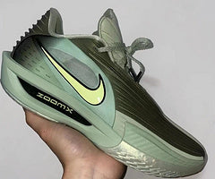 Green Nike GT 3.5 basketball shoe with a pale Swoosh and Zoom-branded side detail.