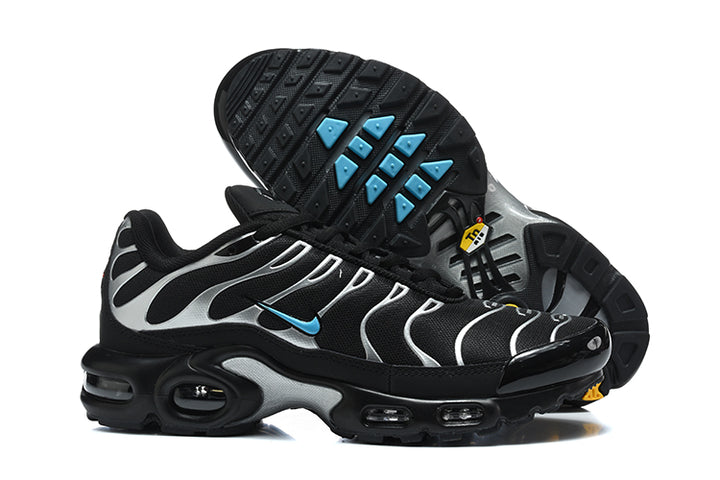 Nike Air Max Plus sneakers showing the black outsole with blue traction accents
