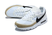 Angled view of Nike Air Max BW sneakers with mesh panels, black Swoosh, and beige toe overlays