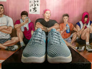 Front view of grey and blue Nike basketball shoes showing textured uppers