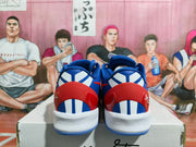 Rear view showing red heel panels, white and blue detailing, and white midsoles.