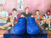 Front view of the royal blue Nike basketball shoes showing the textured uppers and laces.